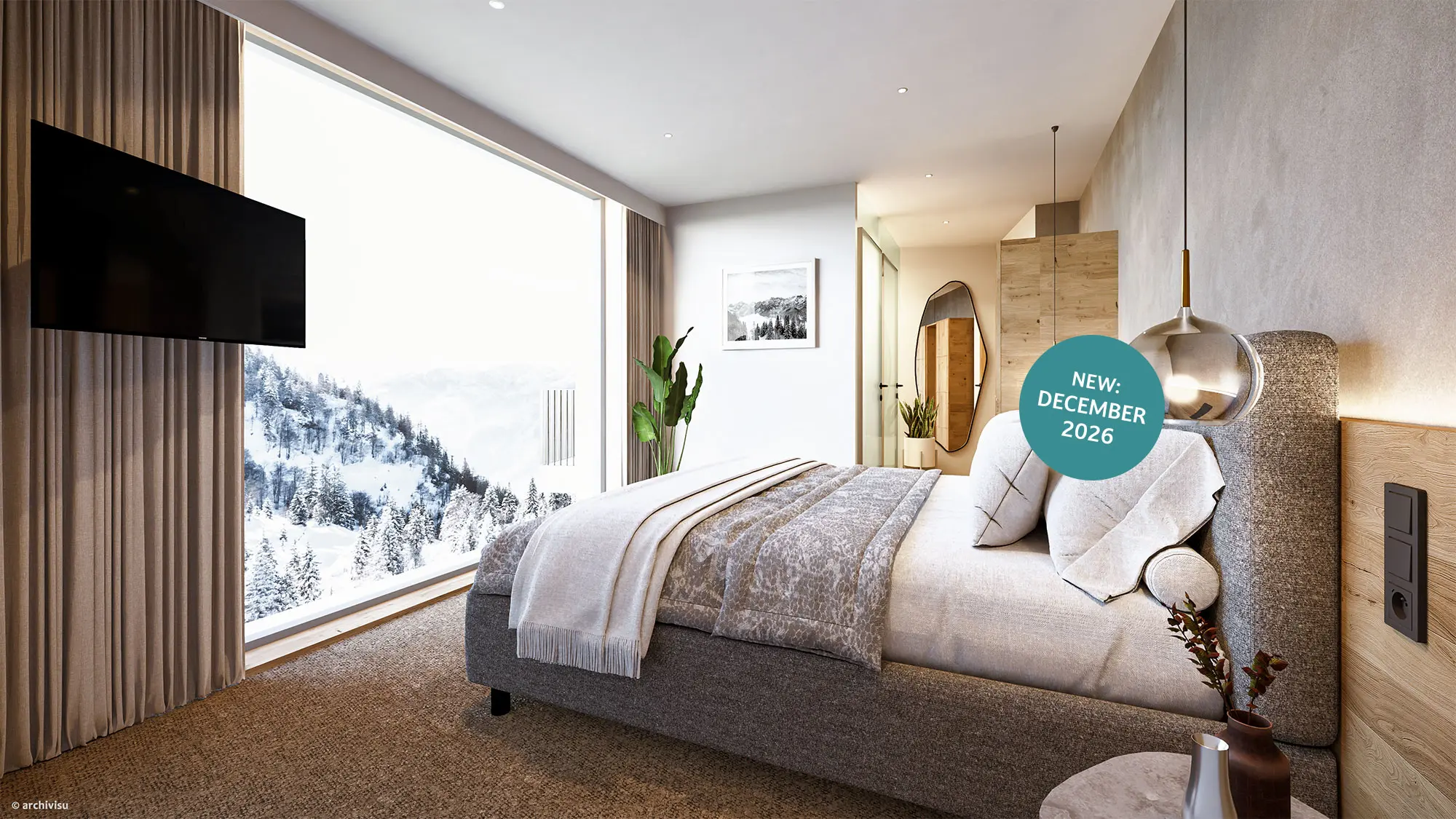 Modernes Schlafzimmer mit großen Fenstern, Blick auf die verschneiten Berge, neutraler Einrichtung und einem an der Wand montierten Fernseher. Türkiser Kreis mit weißer Schrift "New: December 2026" rechts im Bild.